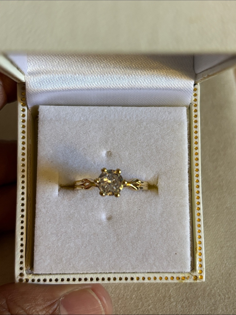 Yellow Gold Solitaire Ring with Twisted Band and Clear Stone